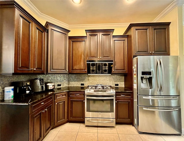 kitchen with decorative backsplash, dark stone counters, stainless steel appliances, ornamental molding, and light tile patterned floors