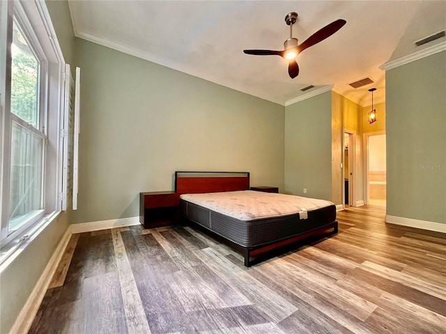 unfurnished bedroom featuring ornamental molding, ceiling fan, connected bathroom, and wood-type flooring