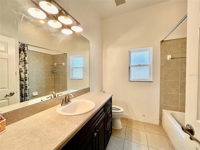 full bathroom with shower / bath combo with shower curtain, tile patterned floors, vanity, and toilet