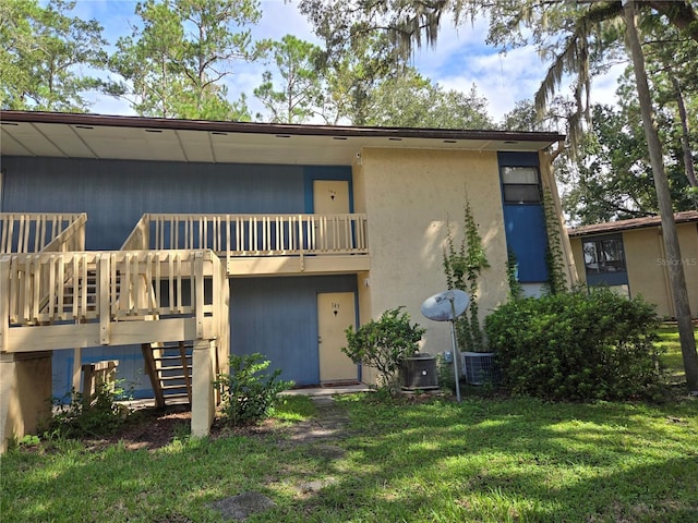 rear view of house with a lawn