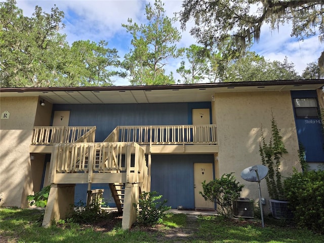 back of house with cooling unit