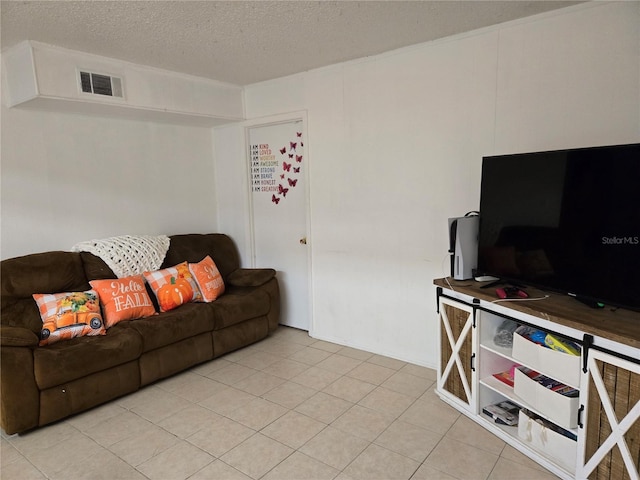 living room featuring a textured ceiling and light tile patterned flooring