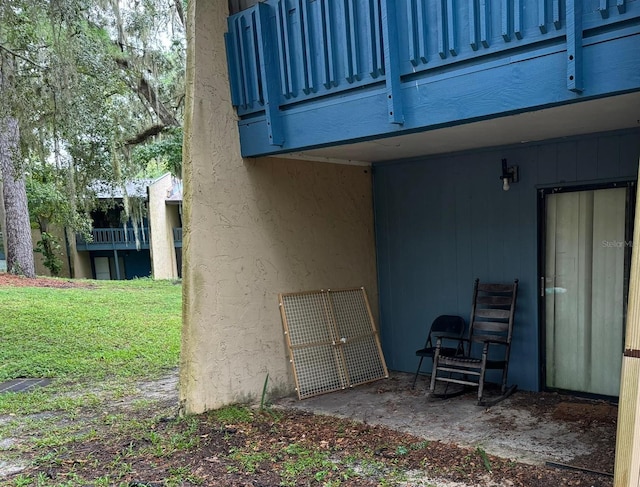 2811 SW Archer Rd Unit R-143, Gainesville, FL 32608 - view of exterior entry featuring a yard