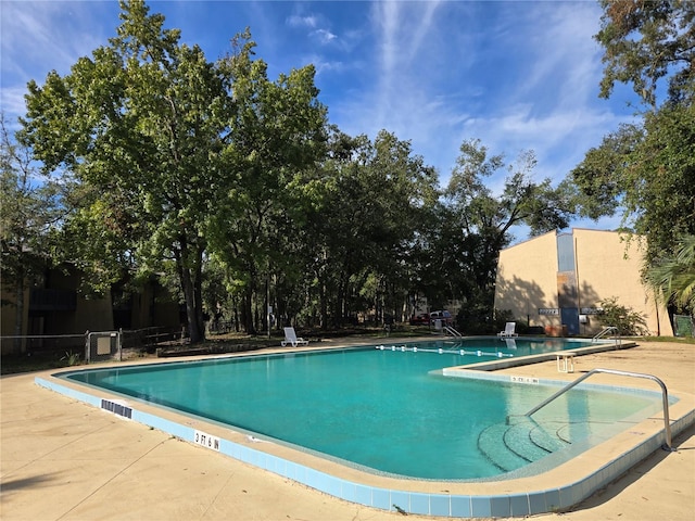 view of swimming pool featuring a patio