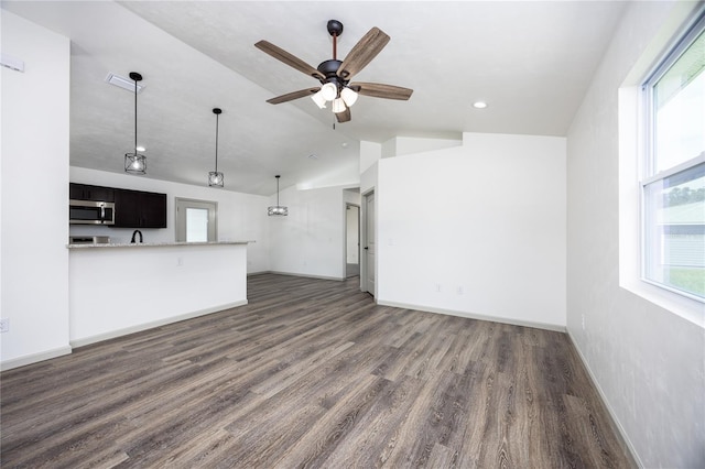 unfurnished living room featuring ceiling fan, baseboards, lofted ceiling, dark wood-style floors, and recessed lighting