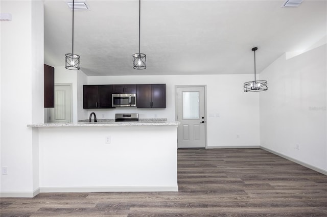 kitchen featuring appliances with stainless steel finishes, baseboards, and dark wood-style flooring