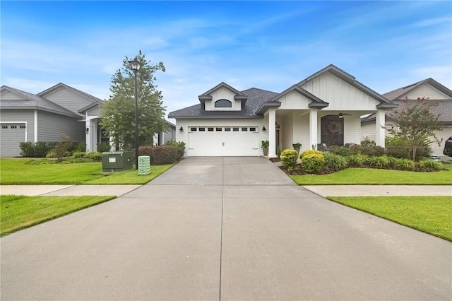 view of front of house featuring a front lawn and a garage