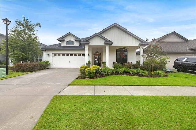 view of front of property with a garage and a front yard