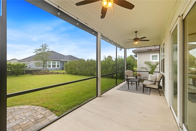 sunroom / solarium with ceiling fan