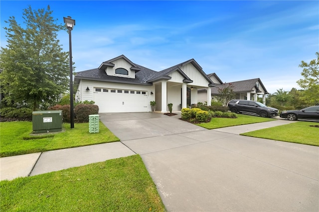 view of front facade with a garage and a front lawn