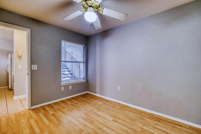 unfurnished room featuring ceiling fan and light wood-type flooring