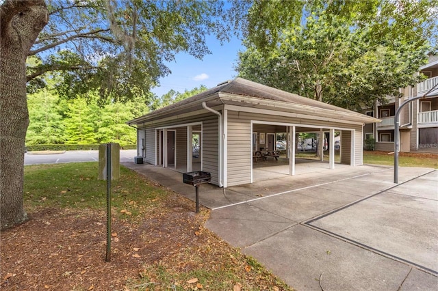 4000 SW 23rd St Unit 3-108, Gainesville, FL 32608 - view of side of property with a carport and driveway