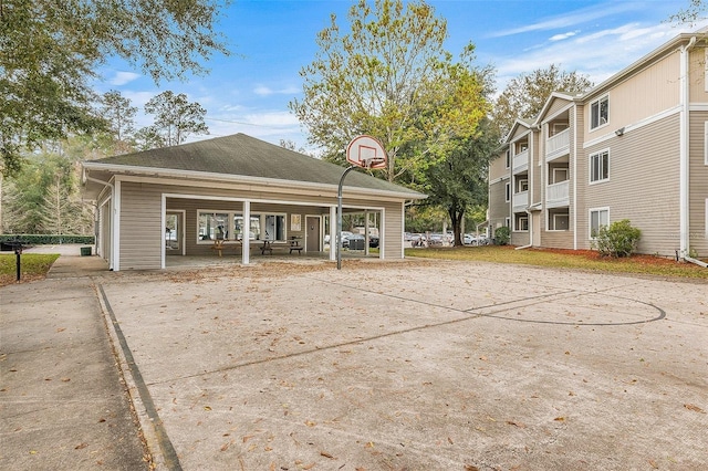 view of property's community featuring basketball hoop