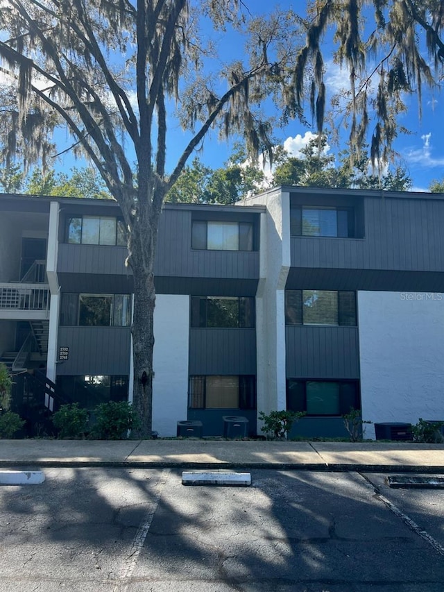 view of building exterior with central air condition unit