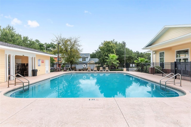 view of swimming pool with a patio area