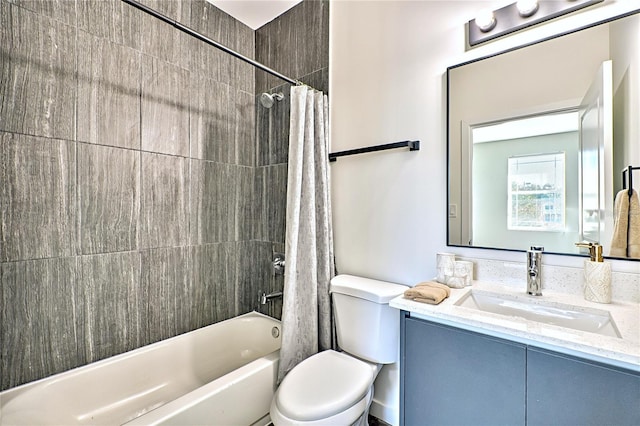 full bathroom featuring vanity, shower / bath combination with curtain, and toilet