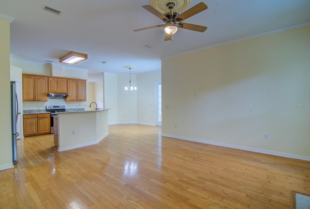 kitchen with pendant lighting, light hardwood / wood-style flooring, stainless steel appliances, ceiling fan with notable chandelier, and crown molding