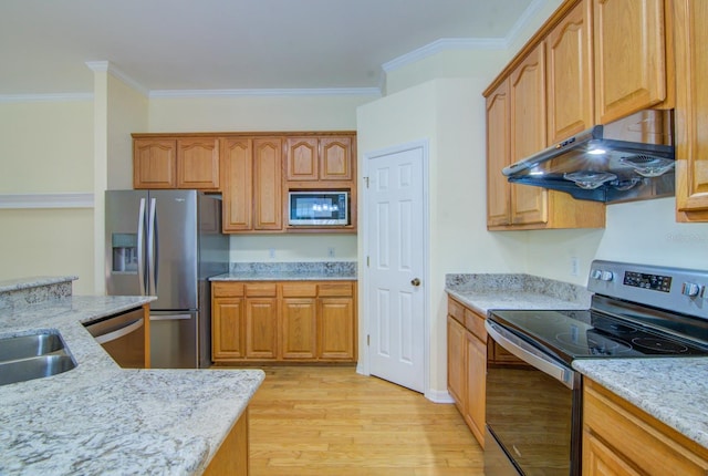 kitchen featuring appliances with stainless steel finishes, light hardwood / wood-style floors, ornamental molding, and light stone counters