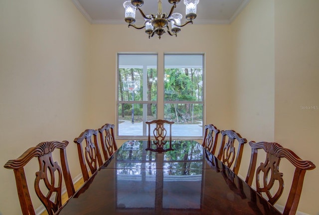 dining space featuring an inviting chandelier and crown molding