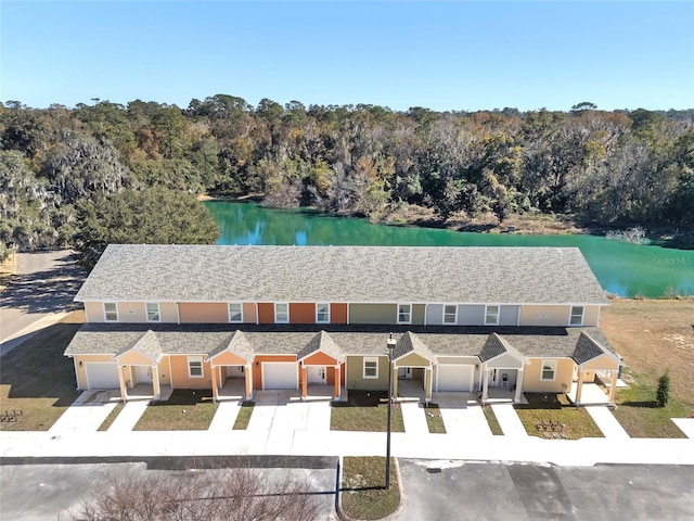 bird's eye view featuring a water view and a wooded view