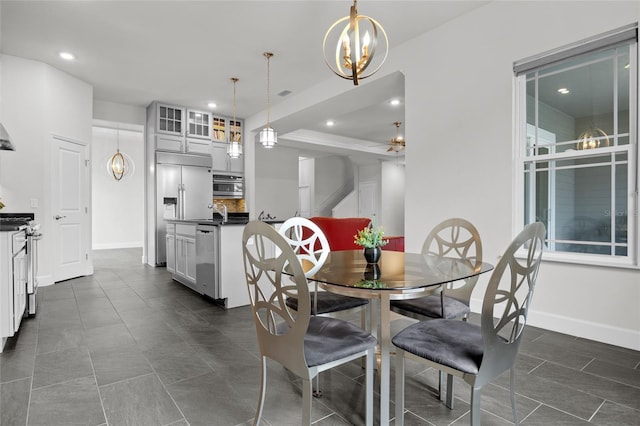 tiled dining space featuring sink