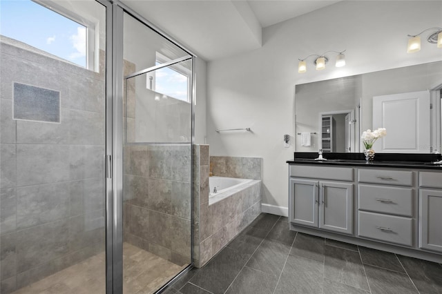 bathroom with vanity, tile patterned floors, and separate shower and tub