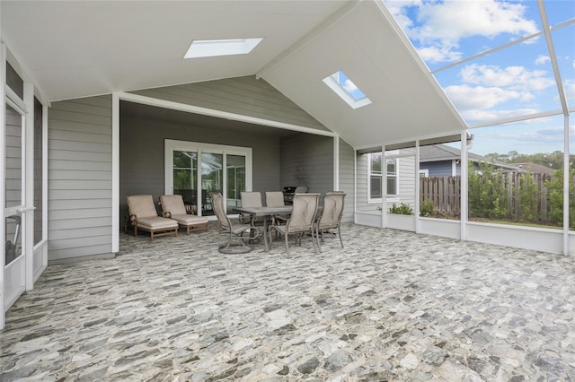 view of patio featuring a lanai