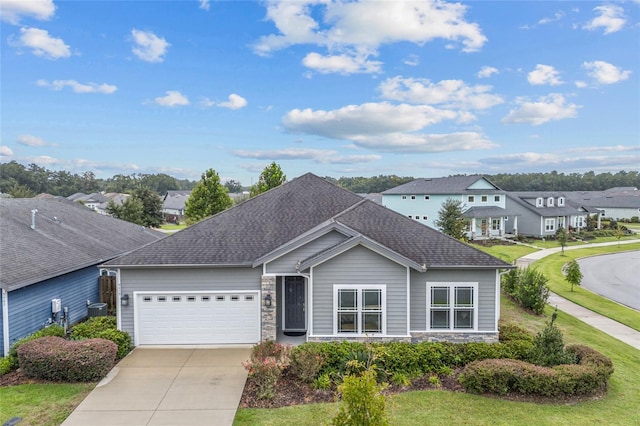 single story home featuring a front yard and a garage