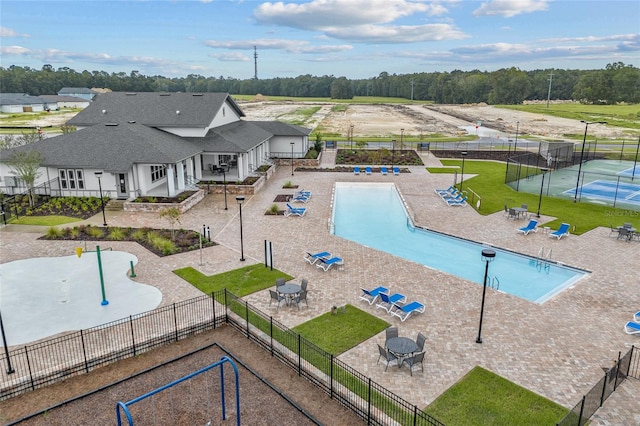 view of swimming pool with a patio