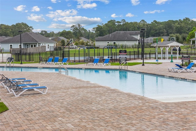 view of pool with a yard and a gazebo