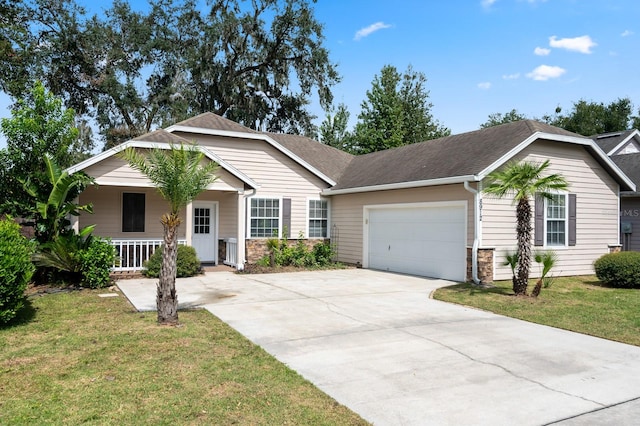 single story home featuring covered porch, a front yard, and a garage