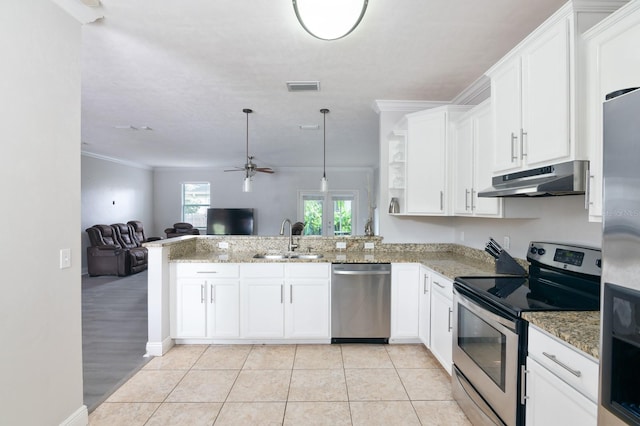 kitchen featuring appliances with stainless steel finishes, kitchen peninsula, sink, and white cabinets