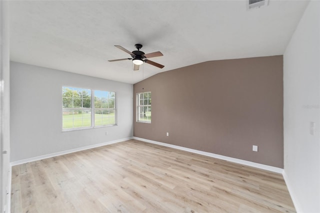 spare room with ceiling fan, light hardwood / wood-style flooring, and lofted ceiling