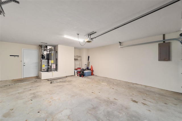 garage with electric panel, a garage door opener, and gas water heater