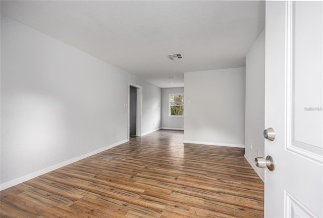 unfurnished room featuring wood-type flooring