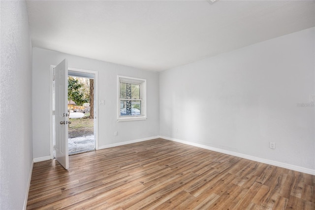 empty room with light hardwood / wood-style floors