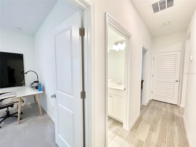 interior space with sink and light hardwood / wood-style floors