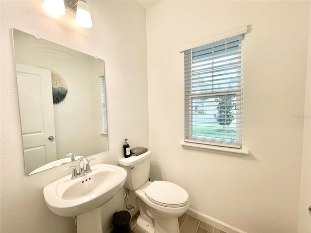 bathroom featuring toilet and sink