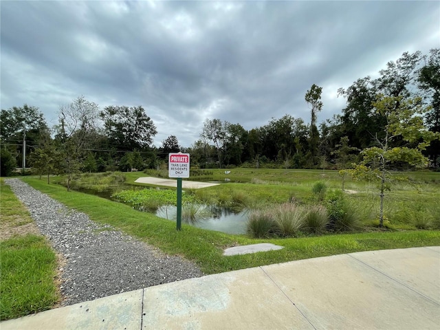 surrounding community with a water view