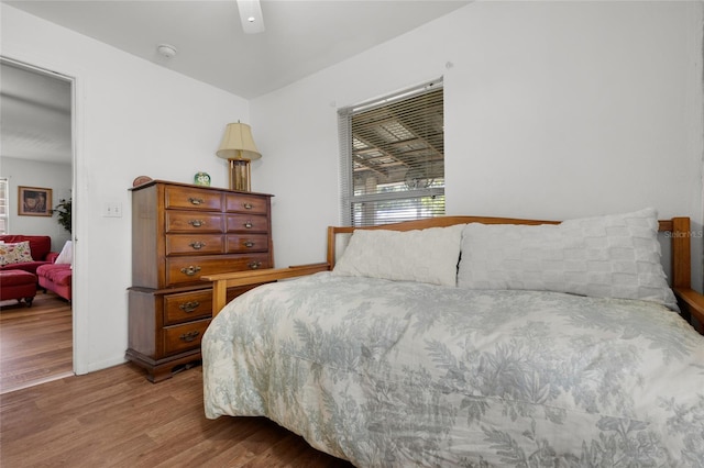 bedroom with ceiling fan and light hardwood / wood-style floors