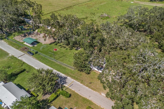 birds eye view of property with a rural view