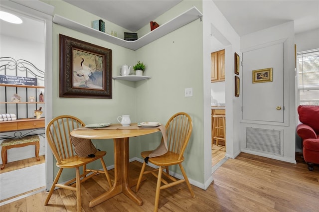 dining room featuring light hardwood / wood-style flooring