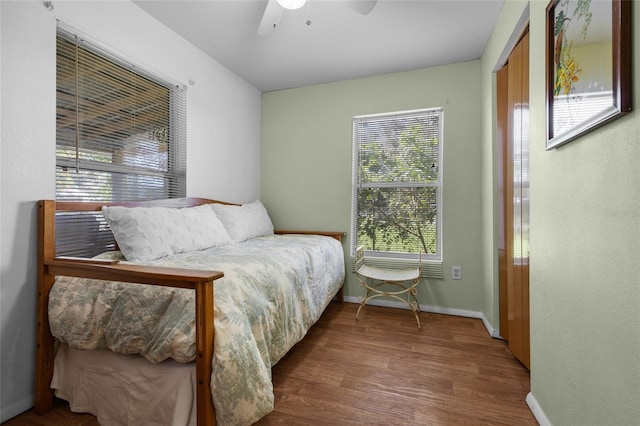 bedroom with hardwood / wood-style flooring and ceiling fan