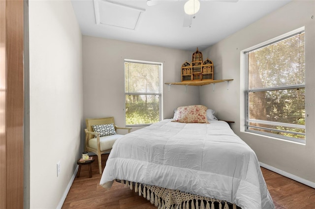 bedroom with ceiling fan and wood-type flooring