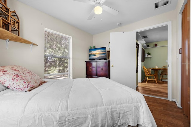 bedroom featuring hardwood / wood-style flooring and ceiling fan