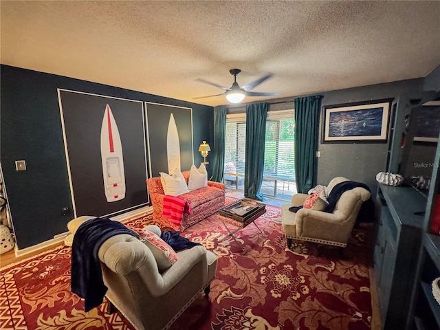 interior space featuring ceiling fan and a textured ceiling