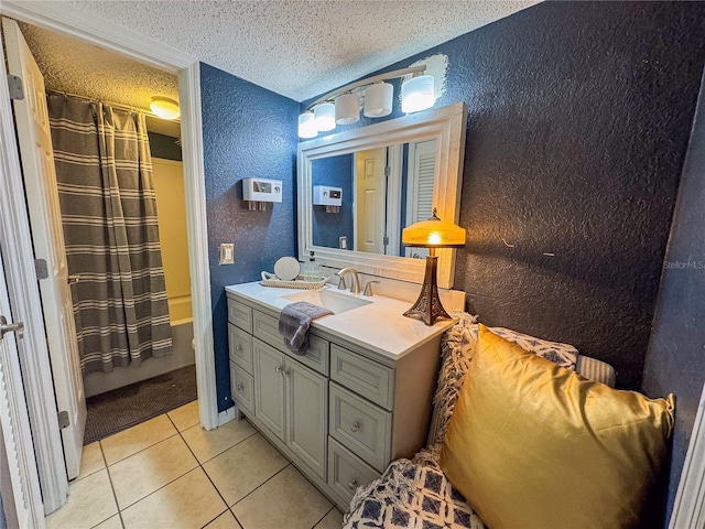 bathroom with shower / tub combo, tile patterned flooring, vanity, and a textured ceiling