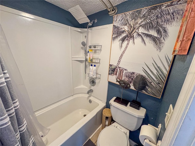 bathroom featuring shower / bath combination with curtain, toilet, and a textured ceiling