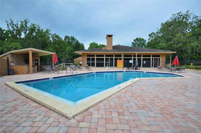 view of pool featuring a patio