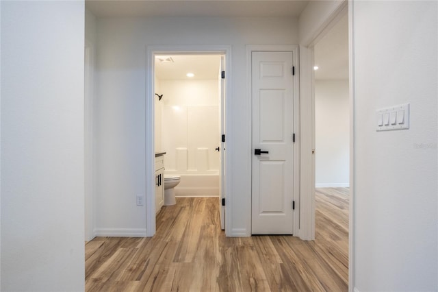 hall featuring light hardwood / wood-style floors